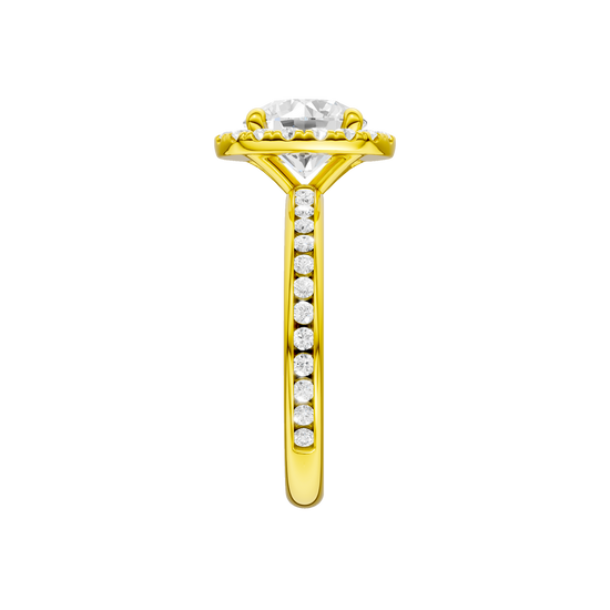 A side view of the Round cut diamond engagement ring in 14k yellow gold with a diamond channel band and halo setting