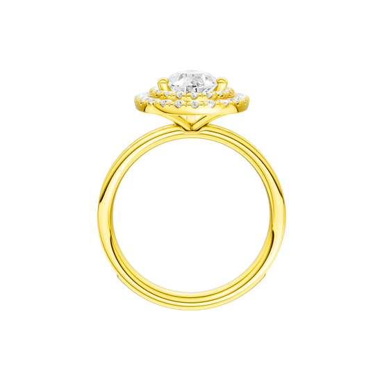 A profile view of the Pear cut diamond engagement ring in 14k yellow gold with a diamond channel band and cathedral setting