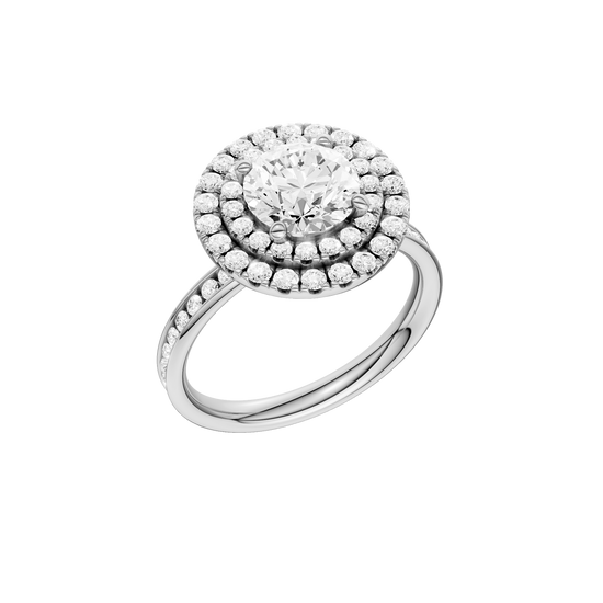A three-quarter view of the Round cut diamond engagement ring in 14k white gold with a diamond channel band and cathedral setting