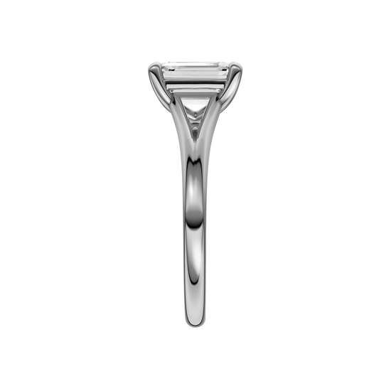 A side view of the Emerald cut diamond engagement ring in platinum with a plain band and split setting