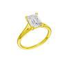 A three-quarter view of the Emerald cut diamond engagement ring in 14k yellow gold with a plain band and split setting