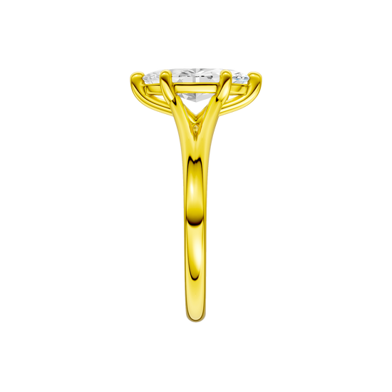 A side view of the Marquise cut diamond engagement ring in 14k yellow gold with a plain band and solitaire setting