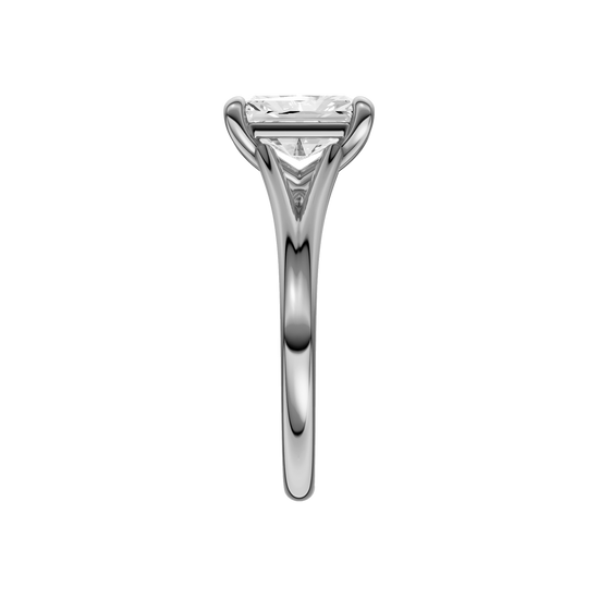 A side view of the Radiant cut diamond engagement ring in 14k white gold with a plain band and split setting