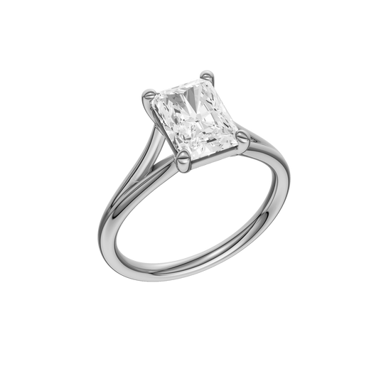 A three-quarter view of the Radiant cut diamond engagement ring in platinum with a plain band and split setting
