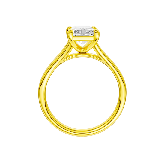 A profile view of the Radiant cut diamond engagement ring in 14k yellow gold with a plain band and split setting