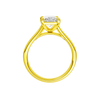 A profile view of the Radiant cut diamond engagement ring in 14k yellow gold with a plain band and split setting