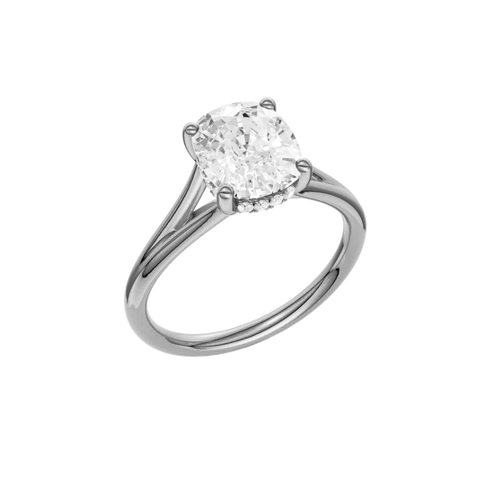 A three-quarter view of the Elongated Cushion cut diamond engagement ring in platinum with a plain band and hidden halo setting