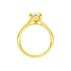 A profile view of the Marquise cut diamond engagement ring in 14k yellow gold with a plain band and hidden halo setting