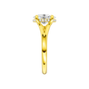 A side view of the Oval cut diamond engagement ring in 14k yellow gold with a plain band and hidden halo setting