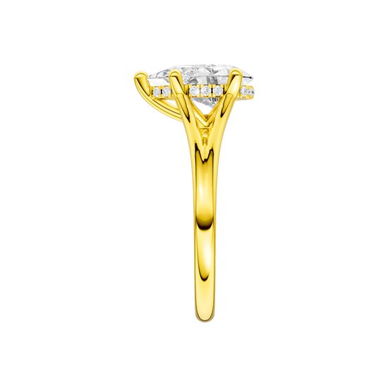 A side view of the Pear cut diamond engagement ring in 14k yellow gold with a plain band and cathedral setting