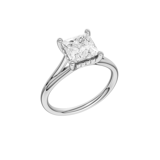 A three-quarter view of the Princess cut diamond engagement ring in platinum with a plain band and hidden halo setting