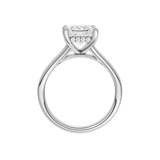A profile view of the Princess cut diamond engagement ring in 14k white gold with a plain band and hidden halo setting