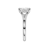 A side view of the Radiant cut diamond engagement ring in platinum with a plain band and hidden halo setting