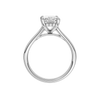 A profile view of the Radiant cut diamond engagement ring in platinum with a plain band and hidden halo setting