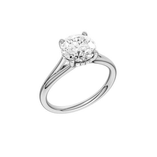 A three-quarter view of the Round cut diamond engagement ring in 14k white gold with a plain band and hidden halo setting
