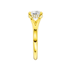 A side view of the Round cut diamond engagement ring in 14k yellow gold with a plain band and hidden halo setting
