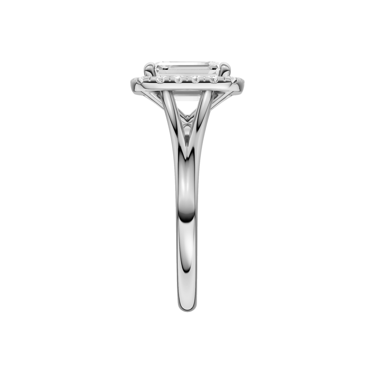 A side view of the Emerald cut diamond engagement ring in 14k white gold with a plain band and halo setting