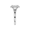A side view of the Radiant cut diamond engagement ring in 14k white gold with a plain band and halo setting