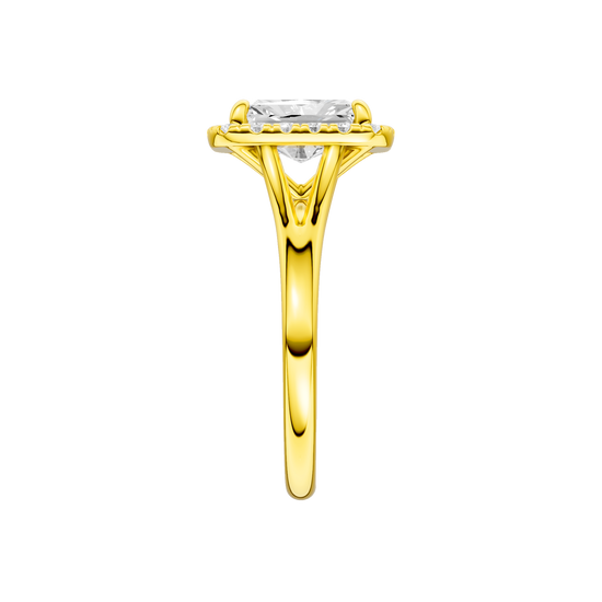 A side view of the Radiant cut diamond engagement ring in 14k yellow gold with a plain band and halo setting
