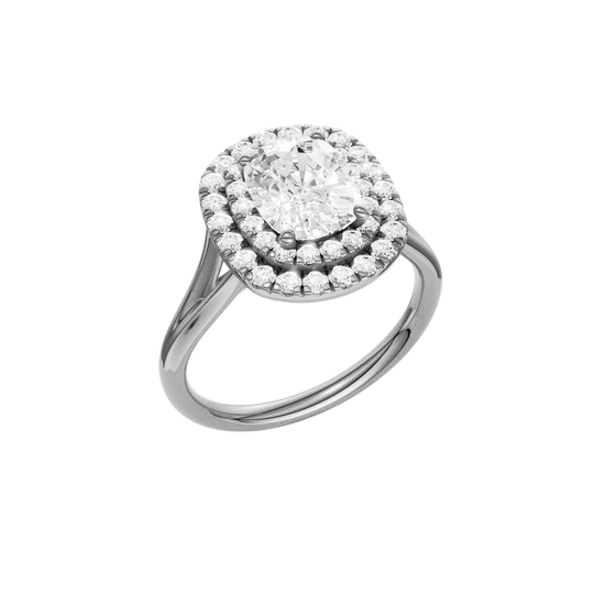 A three-quarter view of the Elongated Cushion cut diamond engagement ring in platinum with a plain band and double halo setting