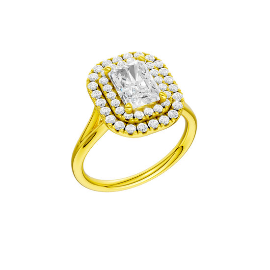 A three-quarter view of the Radiant cut diamond engagement ring in 14k yellow gold with a plain band and cathedral setting