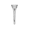 A side view of the Emerald cut diamond engagement ring in 14k white gold with a prong band and solitaire setting