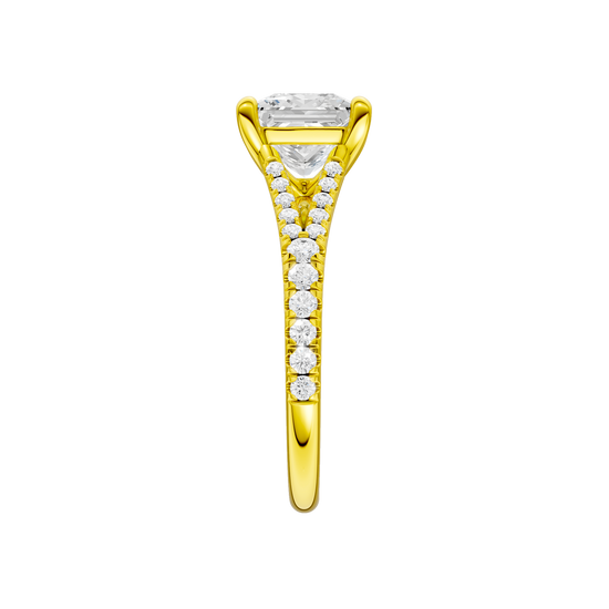 A side view of the Emerald cut diamond engagement ring in 14k yellow gold with a prong band and solitaire setting