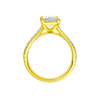 A profile view of the Radiant cut diamond engagement ring in 14k yellow gold with a diamond band and solitaire setting