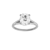 A front view of the Elongated Cushion cut diamond engagement ring in 14k white gold with a diamond band and hidden halo setting