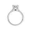 A profile view of the Emerald cut diamond engagement ring in 14k white gold with a prong diamond band and hidden halo setting