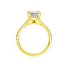 A profile view of the Emerald cut diamond engagement ring in 14k yellow gold with a prong diamond band and hidden halo setting