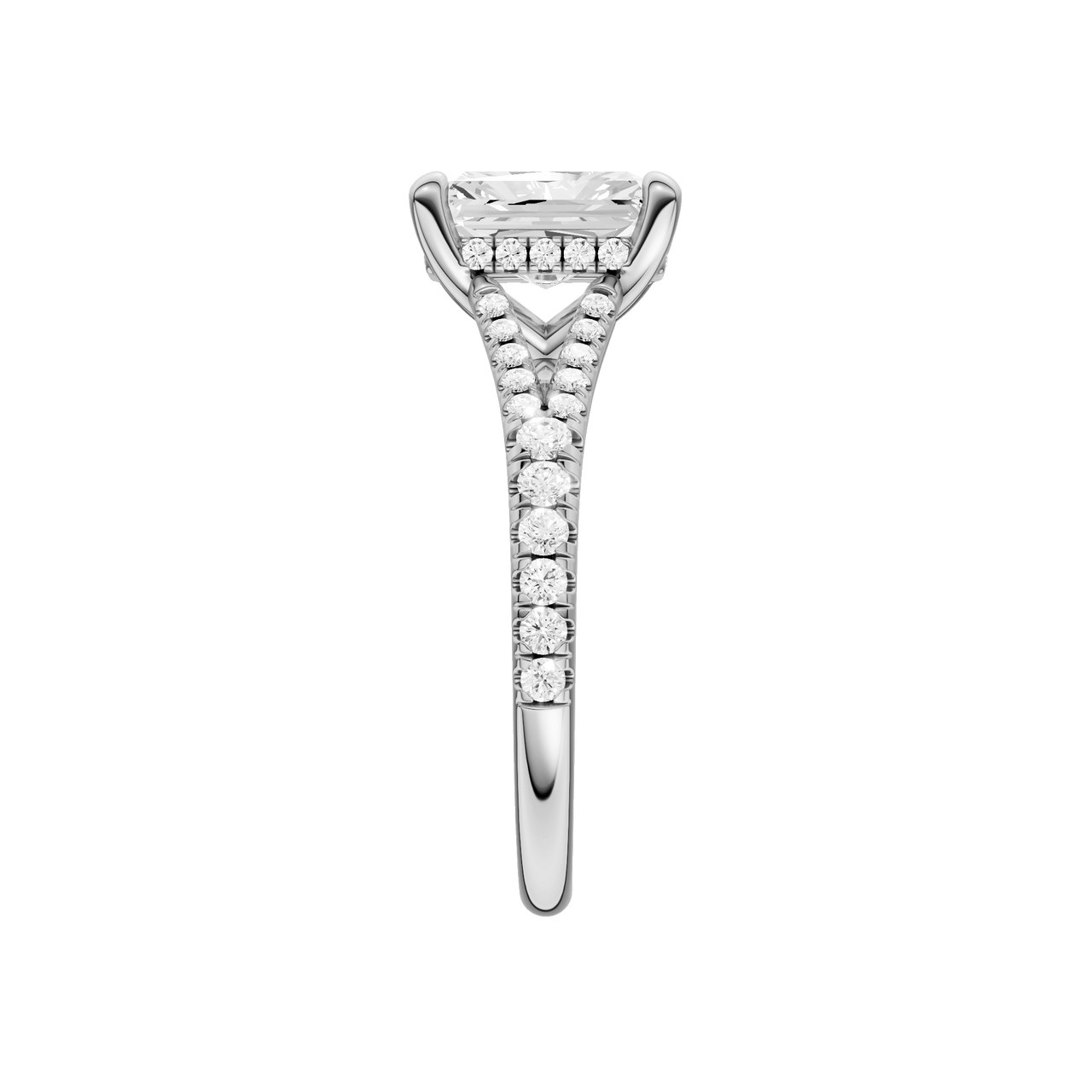 A side view of the Radiant cut diamond engagement ring in 14k white gold with a prong band and hidden halo setting