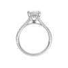 A profile view of the Radiant cut diamond engagement ring in platinum with a prong band and hidden halo setting