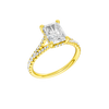 A three-quarter view of the Radiant cut diamond engagement ring in 14k yellow gold with a prong band and hidden halo setting