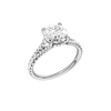 A three-quarter view of the Round cut diamond engagement ring in platinum with a prong band and hidden halo setting