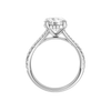 A profile view of the Round cut diamond engagement ring in 14k white gold with a prong band and hidden halo setting