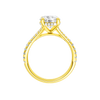 A profile view of the Round cut diamond engagement ring in 14k yellow gold with a prong band and hidden halo setting