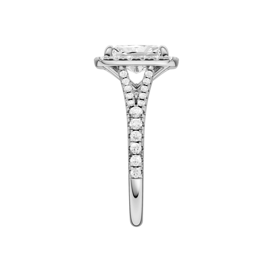 A side view of the Radiant cut diamond engagement ring in 14k white gold with a diamond band and halo setting