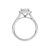 A profile view of the Radiant cut diamond engagement ring in 14k white gold with a diamond band and halo setting