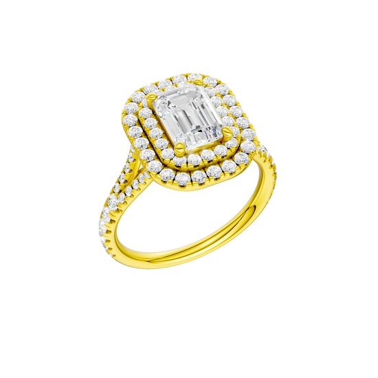A three-quarter view of the Emerald cut diamond engagement ring in 14k yellow gold with a prong diamond band and split setting