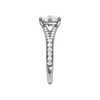 A side view of the Elongated cushion cut diamond engagement ring in 14k white gold with a diamond channel band and split setting