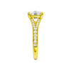 A side view of the Elongated cushion cut diamond engagement ring in 14k yellow gold with a diamond channel band and split setting