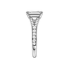 A side view of the Emerald cut diamond engagement ring in platinum with a diamond channel band and split setting