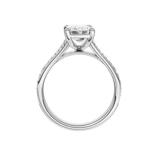 A profile view of the Emerald cut diamond engagement ring in 14k white gold with a diamond channel band and split setting
