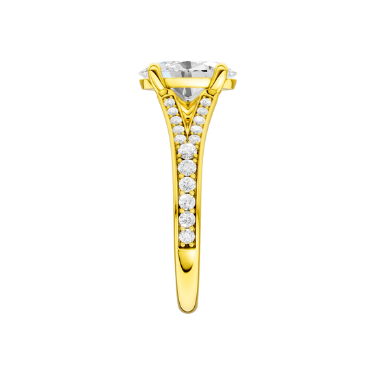 A side view of the Oval cut diamond engagement ring in 14k yellow gold with a diamond channel band and split setting
