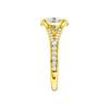 A side view of the Oval cut diamond engagement ring in 14k yellow gold with a diamond channel band and split setting
