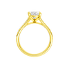 A profile view of the Oval cut diamond engagement ring in 14k yellow gold with a diamond channel band and split setting