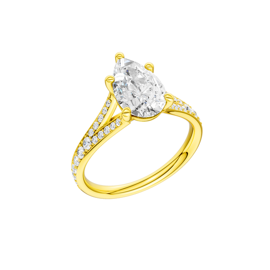 A three-quarter view of the Pear cut diamond engagement ring in 14k yellow gold with a diamond channel band and split setting
