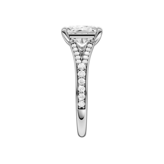 A side view of the Radiant cut diamond engagement ring in 14k white gold with a diamond channel band and split setting