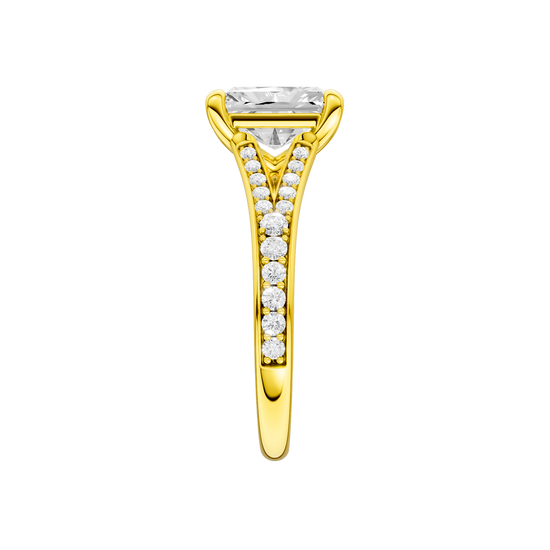 A side view of the Radiant cut diamond engagement ring in 14k gold gold with a diamond channel band and split setting